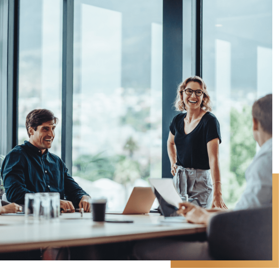 smiling woman standing on a table during meeting