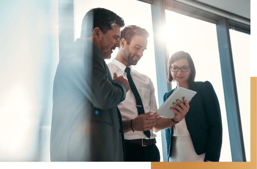 employees discussing and checking the tablet