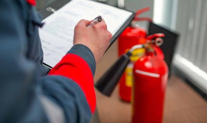 Professional Fire Safety Compliance inspection checking fire safety sections in their facility management compliance checklist