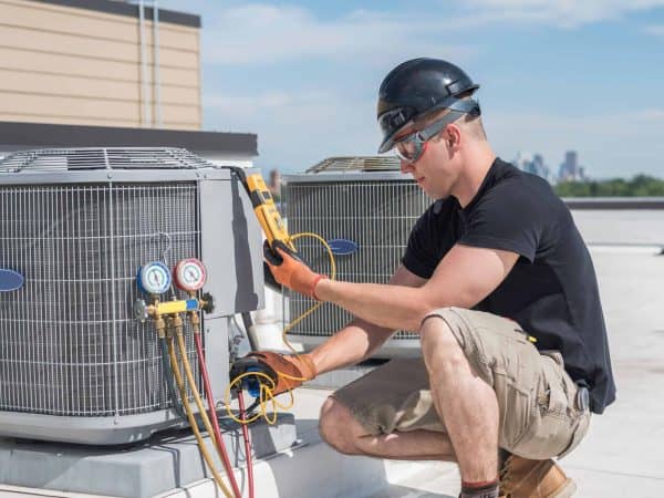 man testing electrical equipment